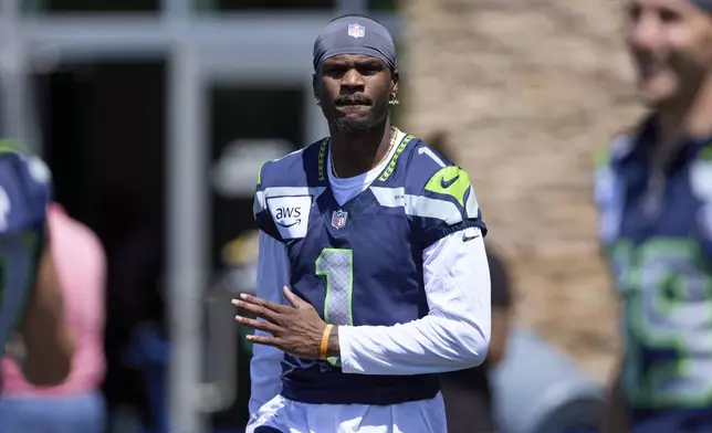 FILE - Seattle Seahawks wide receiver Marquez Valdes-Scantling warms up during practice at NFL football minicamp, June 10, 2025, at the team's training facility in Renton, Wash. (AP Photo/John Froschauer, File)