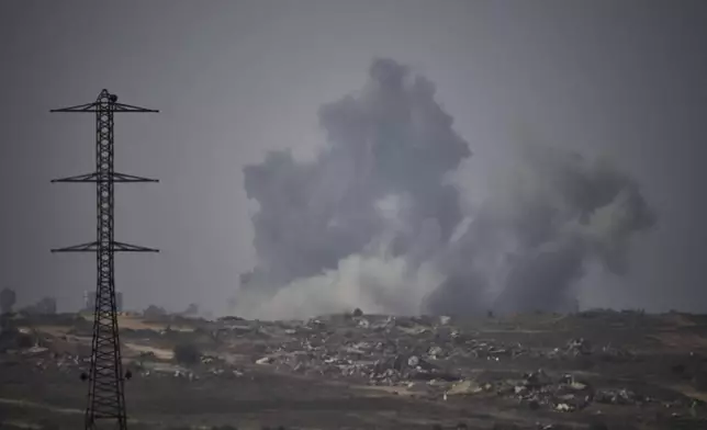 Smoke rises to the sky following an Israeli military strike in the Gaza Strip, as seen from southern Israel, Thursday, Sept. 18, 2025. (AP Photo/Leo Correa)