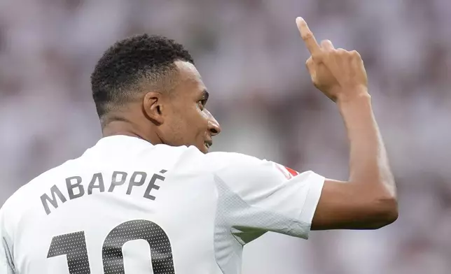 Real Madrid's Kylian Mbappe celebrates after scoring his side's second goal during the Spanish La Liga soccer match between Real Madrid and Espanyol at the Santiago Bernabeu stadium in Madrid, Spain, Saturday, Sept. 20, 2025. (AP Photo/Manu Fernandez)