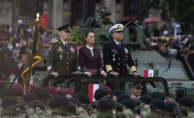 President Claudia Sheinbaum rides through the annual Independence Day military parade, in Mexico City, Tuesday, Sept. 16, 2025. (AP Photo/Fernando Llano)