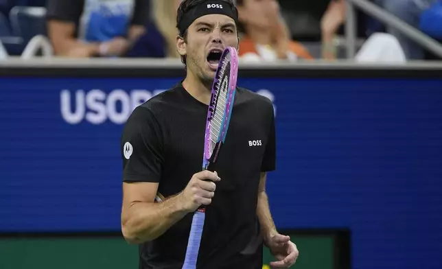 Taylor Fritz, of the United States, reacts after a rally against Tomas Machac, of the Czech Republic, during the fourth round of the U.S. Open tennis championships, Sunday, Aug. 31, 2025, in New York. (AP Photo/Pamela Smith)
