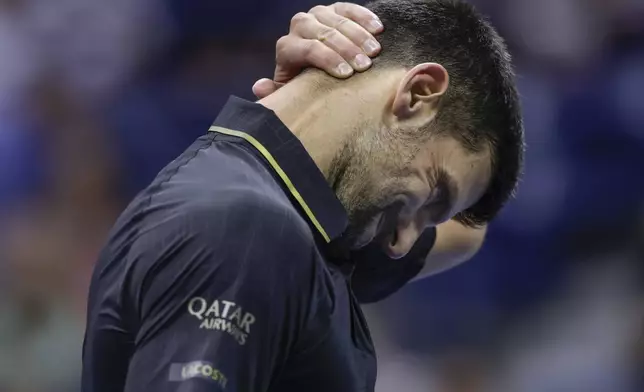 Novak Djokovic, of Serbia, reacts after a really against Jan-Lennard Struff, of Germany, during the fourth round of the U.S. Open tennis championships, Sunday, Aug. 31, 2025, in New York. (AP Photo/Adam Hunger)