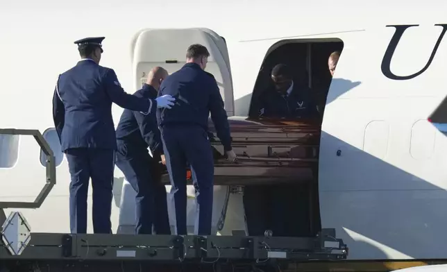 The casket containing the body of Charlie Kirk, the CEO and co-founder of Turning Point USA who was shot and killed is removed from Air Force Two at Phoenix Sky Harbor International Airport, Thursday, Sept. 11, 2025, in Phoenix. (AP Photo/Ross D. Franklin)