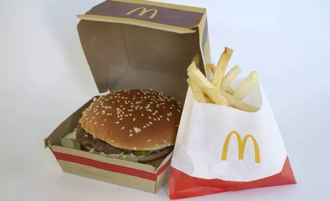 FILE - A McDonald's Big Mac, left, rests in a box next to a bag of McDonald's fries, in Walpole, Mass., Wednesday, April 20, 2022. (AP Photo/Steven Senne, File)