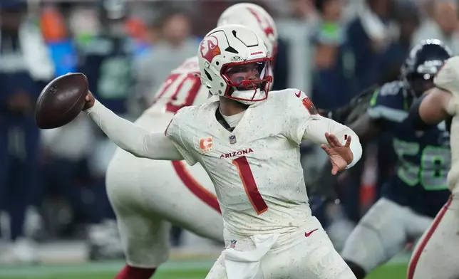 Arizona Cardinals quarterback Kyler Murray (1) throws during the first half of an NFL football game against the Seattle Seahawks Thursday, Sept. 25, 2025, in Glendale, Ariz. (AP Photo/Ross D. Franklin)