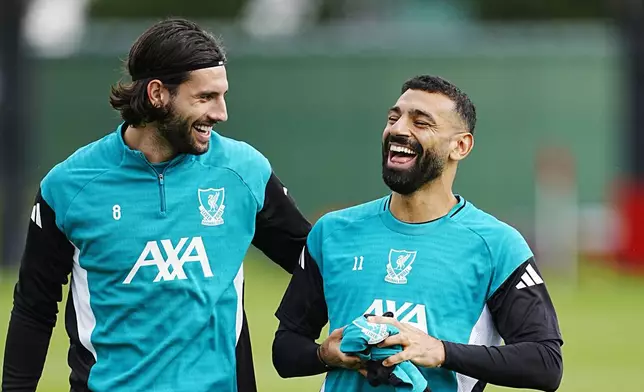 Liverpool's Dominik Szoboszlai and Mohamed Salah, right, during a training session at the AXA Training Centre, Liverpool, England, Tuesday Sept. 16, 2025. (Peter Byrne/PA via AP)