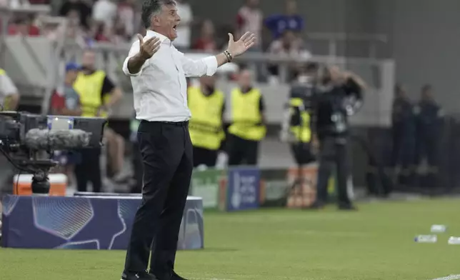 Olympiacos' head coach Jose Luis Mendilibar reacts during a Champions League opening phase soccer match between Olympiakos and Pafos at the Georgios Karaiskakis stadium, Piraeus port, near Athens, Greece, Wednesday, Sept. 17, 2025. (AP Photo/Petros Giannakouris)