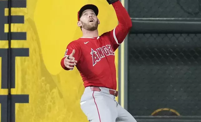 Los Angeles Angels left fielder Taylor Ward catches a line drive hit by Houston Astros' Jeremy Pena during the fourth inning of a baseball game in Houston, Saturday, Aug. 30, 2025. (AP Photo/Ashley Landis)