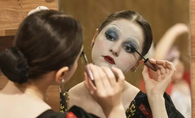 A Baghdad Ballet Academy student prepares to perform "Alice in Wonderland" at Al-Rashid Theater in Baghdad, Iraq, Friday, Aug. 29, 2025. (AP Photo/Hadi Mizban)