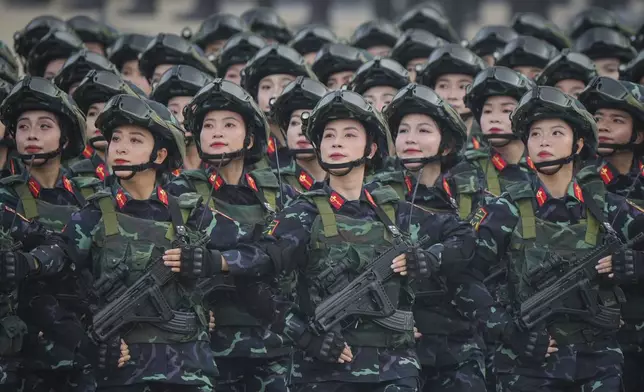 Vietnamese troops march during a parade celebrating the 80th anniversary of independence in Hanoi, Vietnam Tuesday, Sept. 2, 2025. (AP Photo/Vincent Thian, Pool)