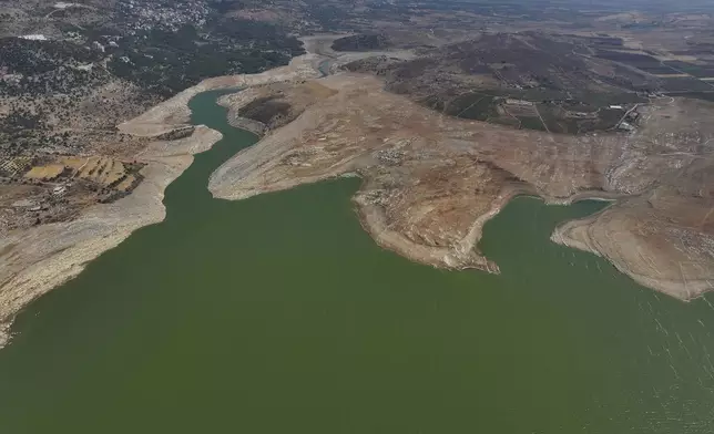 A drone view shows dramatically low water levels at Lake Qaraoun, one of the Lebanon's largest reservoirs, in Qaraoun village, eastern Lebanon, on Aug. 6, 2025. (AP Photo/Hussein Malla)