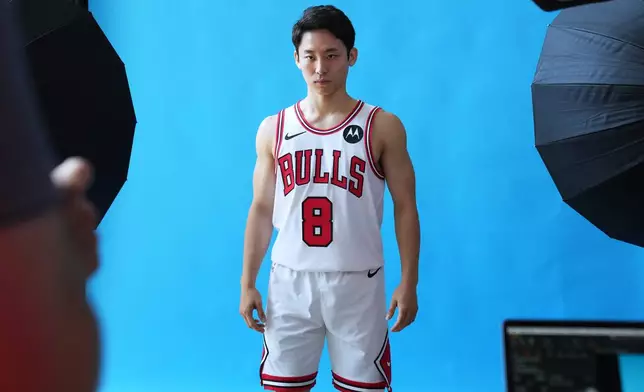 Chicago Bulls' Yuki Kawamura, of Japan, poses for photographers during the NBA basketball team's media day in Chicago, Monday, Sept. 29, 2025. (AP Photo/Nam Y. Huh)