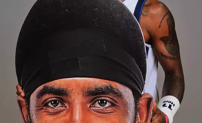 Dallas Mavericks guard Kyrie Irving poses for a photo during the NBA basketball team's media day in Dallas, Monday, Sept. 29, 2025. (AP Photo/LM Otero)