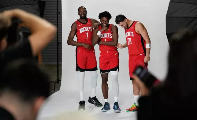 Houston Rockets forward Kevin Durant (7), forward Amen Thompson (1) and center Alperen Sengun (28) participate in the NBA basketball team's media day in Houston, Monday, Sept. 29, 2025. (AP Photo/Ashley Landis)