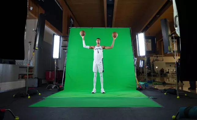 San Antonio Spurs forward Victor Wembanyama poses during the NBA basketball team's media day in San Antonio, Monday, Sept. 29, 2025. (AP Photo/Darren Abate)