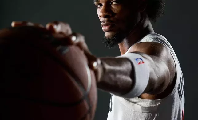 Portland Trail Blazers guard Scoot Henderson poses for photos during the NBA basketball team's media day in Portland, Ore., Monday, Sept. 29, 2025. (AP Photo/Craig Mitchelldyer)