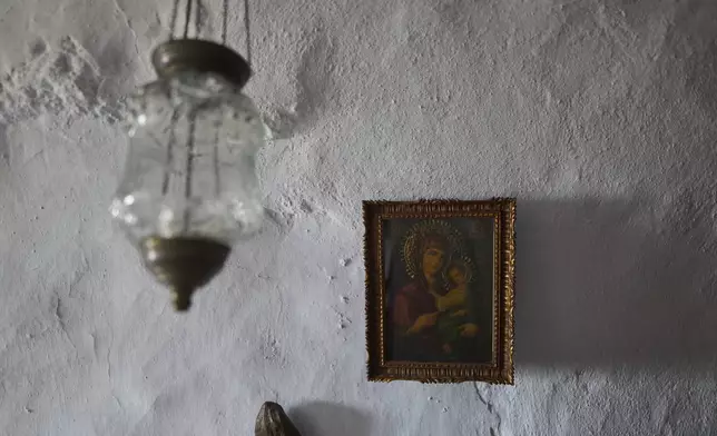 An icon of the Virgin Mary holding the Christ child is displayed inside Agios Giorgos (St. George), a 200-year-old chapel near the village of Volax on Tinos island, Greece, Thursday, Sept. 4, 2025. (AP Photo/Petros Giannakouris)
