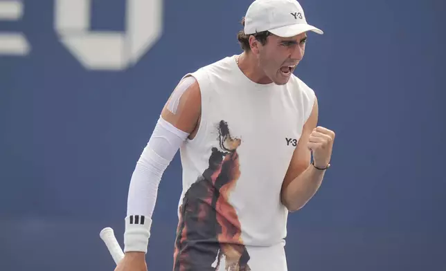 Ivan Ivanov, of Bulgaria reacts after scoring a point against Alexander Vasilev, of Bulgaria, during the junior boys' singles final of the U.S. Open tennis championships, Saturday, Sept. 6, 2025, in New York. (AP Photo/Seth Wenig)