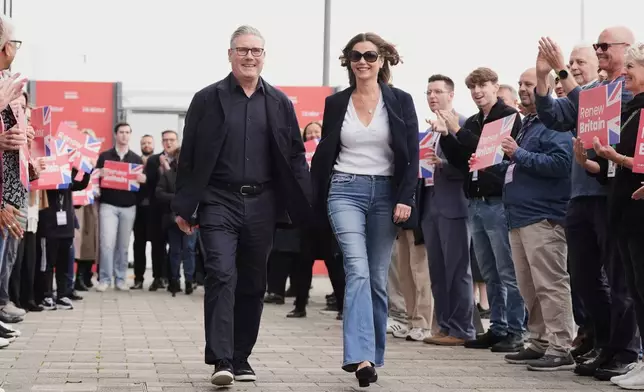Britain's Prime Minister Keir Starmer and his wife Victoria arrive ahead of the Labour Party Conference at the ACC Liverpool, in Liverpool, England, Saturday, Sept. 27, 2025. (Stefan Rousseau/PA via AP)