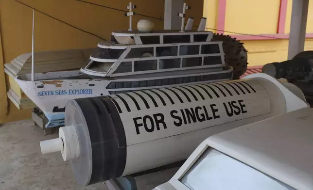 Fantasy coffins crafted by Nicholas and his family are displayed at their showroom in Teshie, Accra, Ghana, Tuesday, July 29, 2025. (AP Photo/ Misper Apawu)