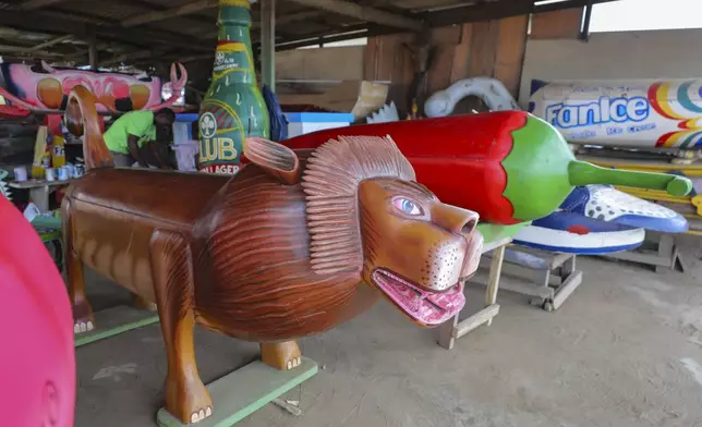 Fantasy coffins are displayed at Eric Kpakpo's carpentry shop in La, Accra, Ghana, Wednesday, July 23, 2025. (AP Photo/Misper Apawu)