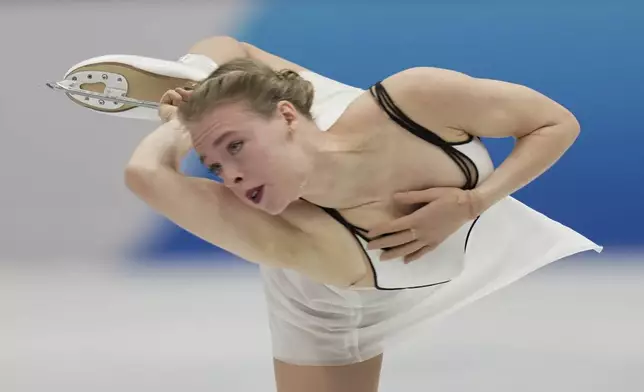 Anastasiia Gubanova, of Georgia, performs during the women's free skating program at the ISU Skate to Milano figure skating qualifier, Saturday, Sept. 20, 2025, in Beijing, China. (AP Photo/Mahesh Kumar A.)