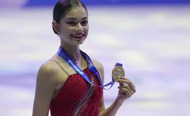 Adeliia Petrosian of Russia, competing as a neutral athlete, with her Gold medal in Women free skating at the ISU Skate to Milano figure skating qualifier 2025, in Beijing, China, Saturday, Sept. 20, 2025. (AP Photo/Mahesh Kumar A.)