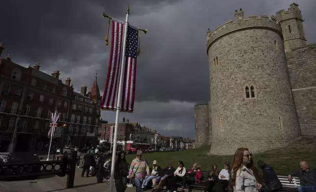 U.S. flag and Union flag are hanged outside the Windsor Castle ahead of the state visit by U.S. President Donald Trump next week in Windsor, England, Friday, Sept. 12, 2025. (AP Photo/Kin Cheung)