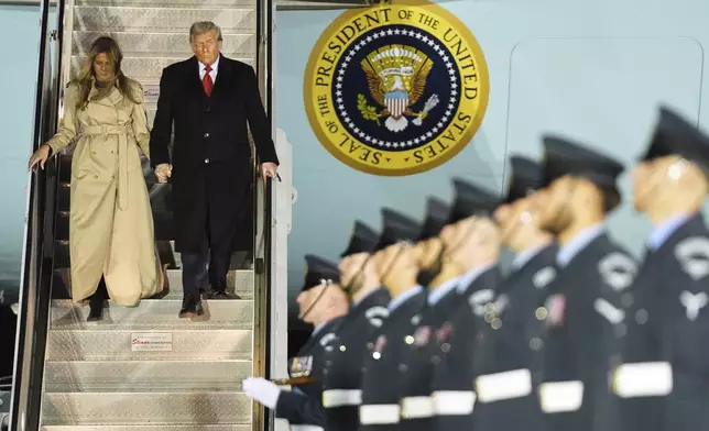 President Donald Trump and first lady Melania Trump exit Air Force One as they arrive at Stansted Airport near London, Tuesday, Sept. 16, 2025. (AP Photo/Evan Vucci)