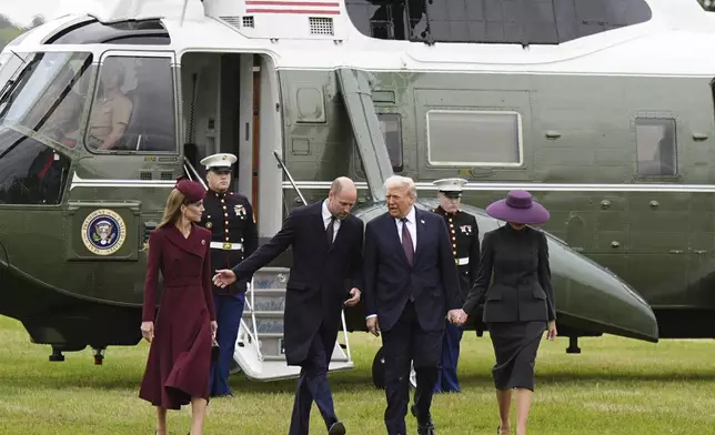 Britain's Prince William and Kate, Princess of Wales, left, receive President Donald Trump and first lady Melania Trump at Windsor Castle in Windsor, England, Wednesday Sept. 17, 2025. (Aaron Chown/Pool Photo via AP)