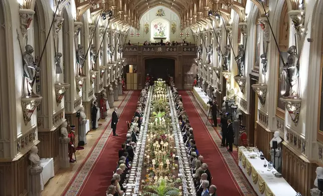 Guests attend a State Banquet during a State visit of President Donald Trump at Windsor Castle in Windsor, England, Wednesday, Sept. 17, 2025. (AP Photo/Evan Vucci, Pool)