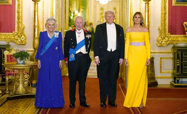 Britain's King Charles III, centre left, and U.S. President Donald Trump, centre right, pose with Queen Camilla and First Lady Melania Trump, right, at the state banquet at Windsor Castle, England, on day one of the president's second state visit to the UK, Wednesday Sept. 17, 2025. (Aaron Chown/PA via AP, Pool)