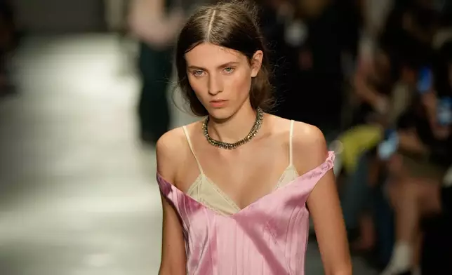 A model wears a creation part of the N21 women's Spring-Summer 2026 collection, that was presented in Milan, Italy, Wednesday, Sept. 24, 2025. (AP Photo/Luca Bruno).