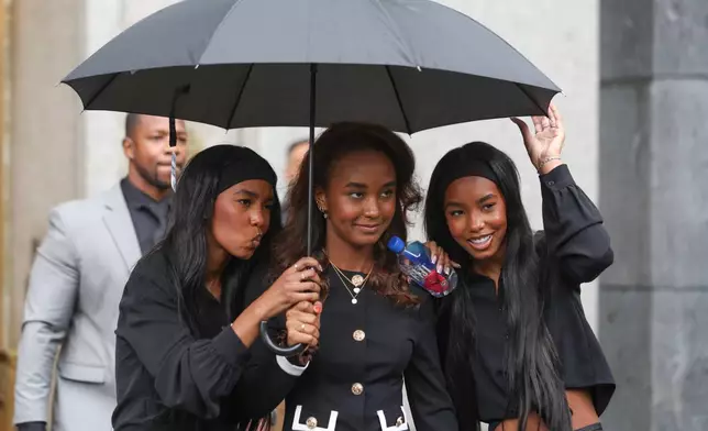 Chance Combs, center, exits Manhattan federal court with D'Lila Combs and Jessie Combs after a hearing for Sean "Diddy" Combs, Thursday, Sept. 25, 2025, in New York. (AP Photo/Heather Khalifa)
