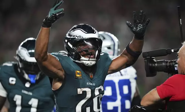 Philadelphia Eagles' Saquon Barkley celebrates after scoring a touchdown in the first half of an NFL football game against the Dallas Cowboys Thursday, Sept. 4, 2025, in Philadelphia. (AP Photo/Matt Slocum)