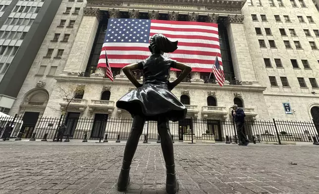 FILE - The Fearless Girl statue stands in front of the New York Stock Exchange in New York's Financial District on Tuesday, Nov. 5, 2024. (AP Photo/Peter Morgan, File)