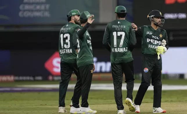 Pakistan players react after their loss in the Asia Cup cricket match against India at Dubai International Cricket Stadium in Dubai, United Arab Emirates, Sunday, Sept. 14, 2025. (AP Photo/Fatima Shbair)