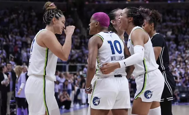 From left, Minnesota Lynx's Kayla McBride, Courtney Williams and Napheesa Collier celebrate after the team's victory over the Golden State Valkyries in the first round of the WNBA basketball playoffs Wednesday, Sept. 17, 2025, in San Jose, Calif. (AP Photo/Godofredo A. Vásquez)