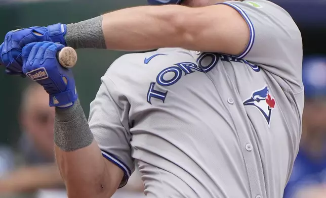 Toronto Blue Jays' Addison Barger watches his RBI double during the fifth inning of a baseball game against the Kansas City Royals, Sunday, Sept. 21, 2025, in Kansas City, Mo. (AP Photo/Charlie Riedel)