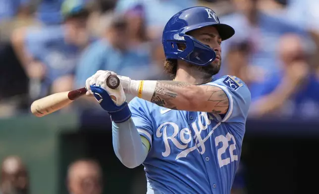 Kansas City Royals' Carter Jensen watches his two-run single during the fourth inning of a baseball game against the Toronto Blue Jays, Sunday, Sept. 21, 2025, in Kansas City, Mo. (AP Photo/Charlie Riedel)