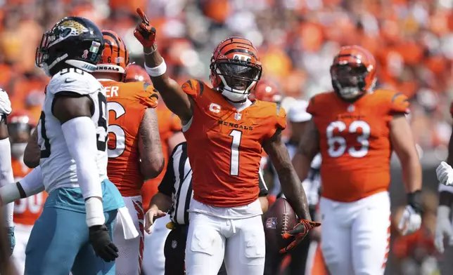 Cincinnati Bengals wide receiver Ja'Marr Chase (1) signals for a first down during the second half of an NFL football game against the Jacksonville Jaguars, Sunday, Sept. 14, 2025, in Cincinnati. (AP Photo/Jeff Dean)