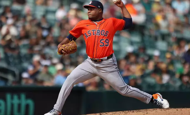 Houston Astros pitcher Framber Valdez throws to an Athletics batter during the third inning of a baseball game Thursday, Sept. 25, 2025, in West Sacramento, Calif. (AP Photo/Scott Marshall)