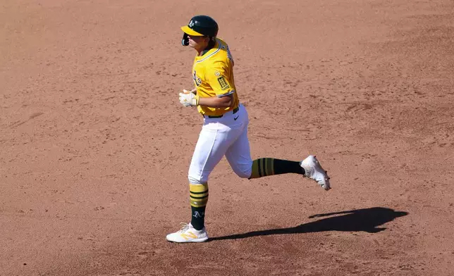 Athletics' Nick Kurtz jogs around the bases after hitting a solo home run during the sixth inning of a baseball game against the Houston Astros, Thursday, Sept. 25, 2025, in West Sacramento, Calif. (AP Photo/Scott Marshall)