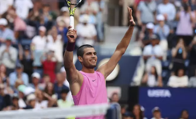 Carlos Alcaraz, of Spain, reacts after beating Arthur Rinderknech, of France, during the fourth round of the U.S. Open tennis championships, Sunday, Aug. 31, 2025, in New York. (AP Photo/Heather Khalifa)