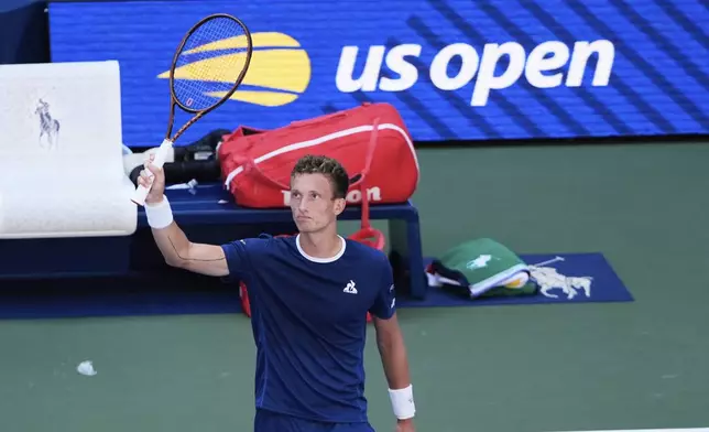 Jiri Lehecka, of the Czech Republic, reacts after defeating Adrian Mannarino, of France, during the fourth round of the U.S. Open tennis championships, Sunday, Aug. 31, 2025, in New York. (AP Photo/Pamela Smith)