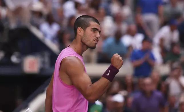Carlos Alcaraz, of Spain, reacts after winning the first set over Arthur Rinderknech, of France, during the fourth round of the U.S. Open tennis championships, Sunday, Aug. 31, 2025, in New York. (AP Photo/Heather Khalifa)