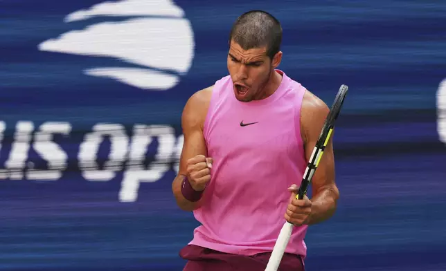 Carlos Alcaraz, of Spain, reacts during his match against Arthur Rinderknech, of France, in the fourth round of the U.S. Open tennis championships, Sunday, Aug. 31, 2025, in New York. (AP Photo/Heather Khalifa)