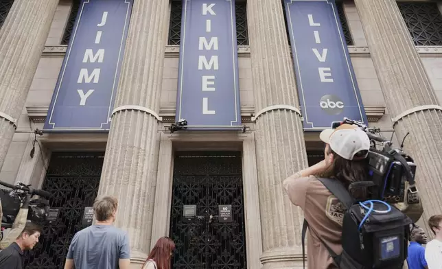 Media gather in front of the Jimmy Kimmel Live studio on Hollywood Blvd., Wednesday, Sept. 17, 2025, in Los Angeles. (AP Photo/Chris Pizzello)