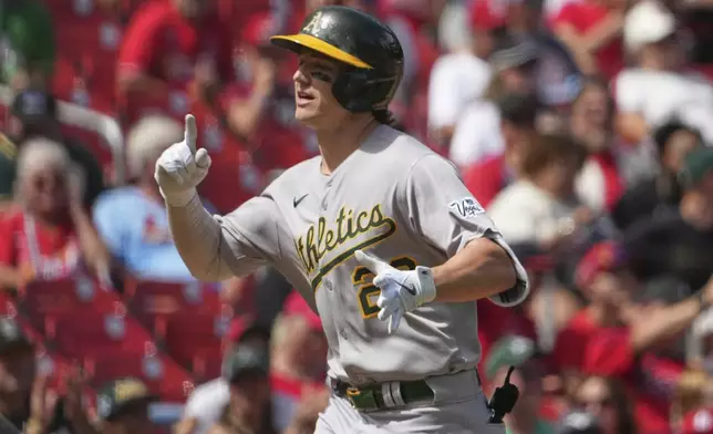 Athletics' Zack Gelof arrives home after hitting a solo home run during the fourth inning of a baseball game against the St. Louis Cardinals Monday, Sept. 1, 2025, in St. Louis. (AP Photo/Jeff Roberson)