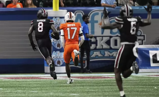 South Carolina wide receiver Nyck Harbor (8) scores in the second half an NCAA college football game against Virginia Tech, Sunday, Aug. 31, 2025, in Atlanta. (AP Photo/Brynn Anderson)